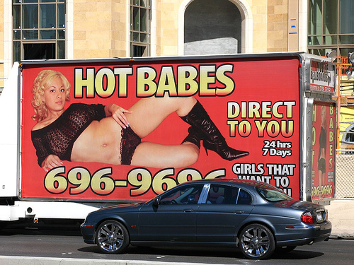 Las Vegas, Nevada - A man hands cards for ´hot sexy girls´ to tourists on  The Strip